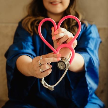 doctor with a stetoscope in a heart form